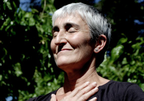 Older woman hand on chest